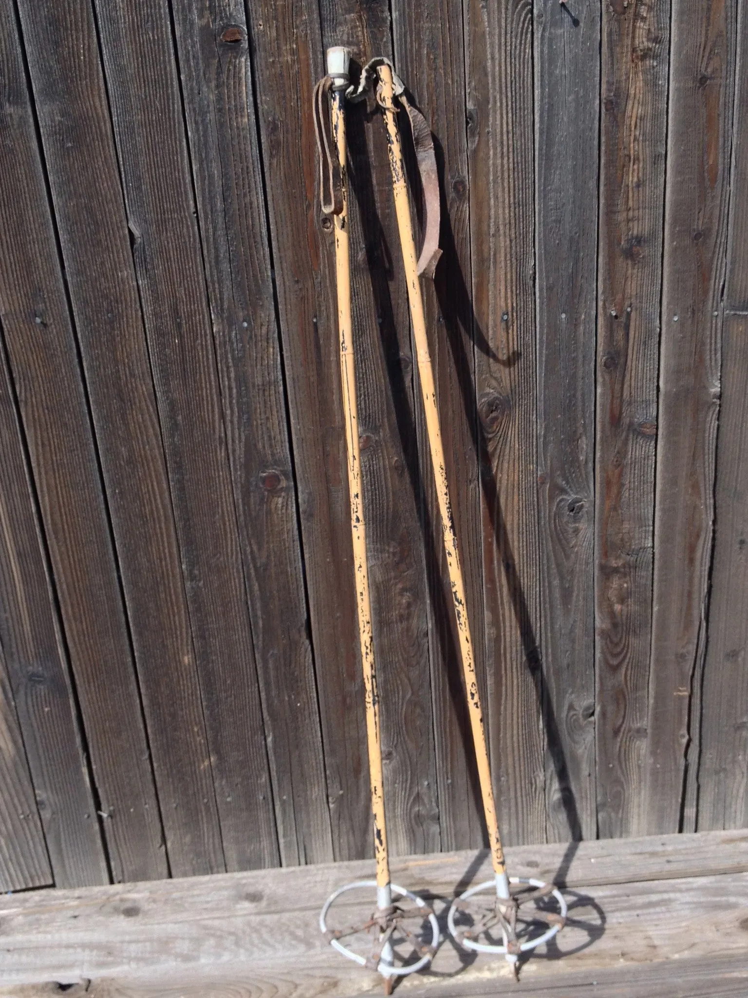 Antique Bamboo Ski Poles with faded black paint